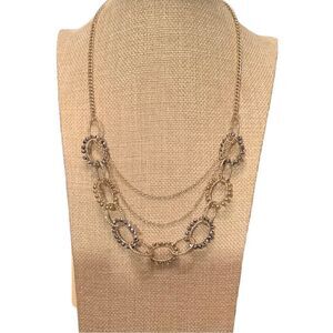 Gold tone multi layer necklace with earrings. NWOT